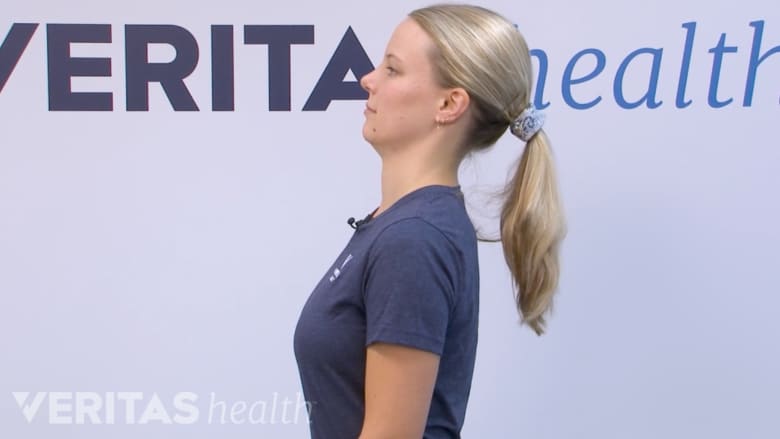 McKenzie method neck exercise head retraction in sitting.