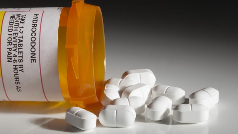 Spilled prescription bottle of hydrocodone.